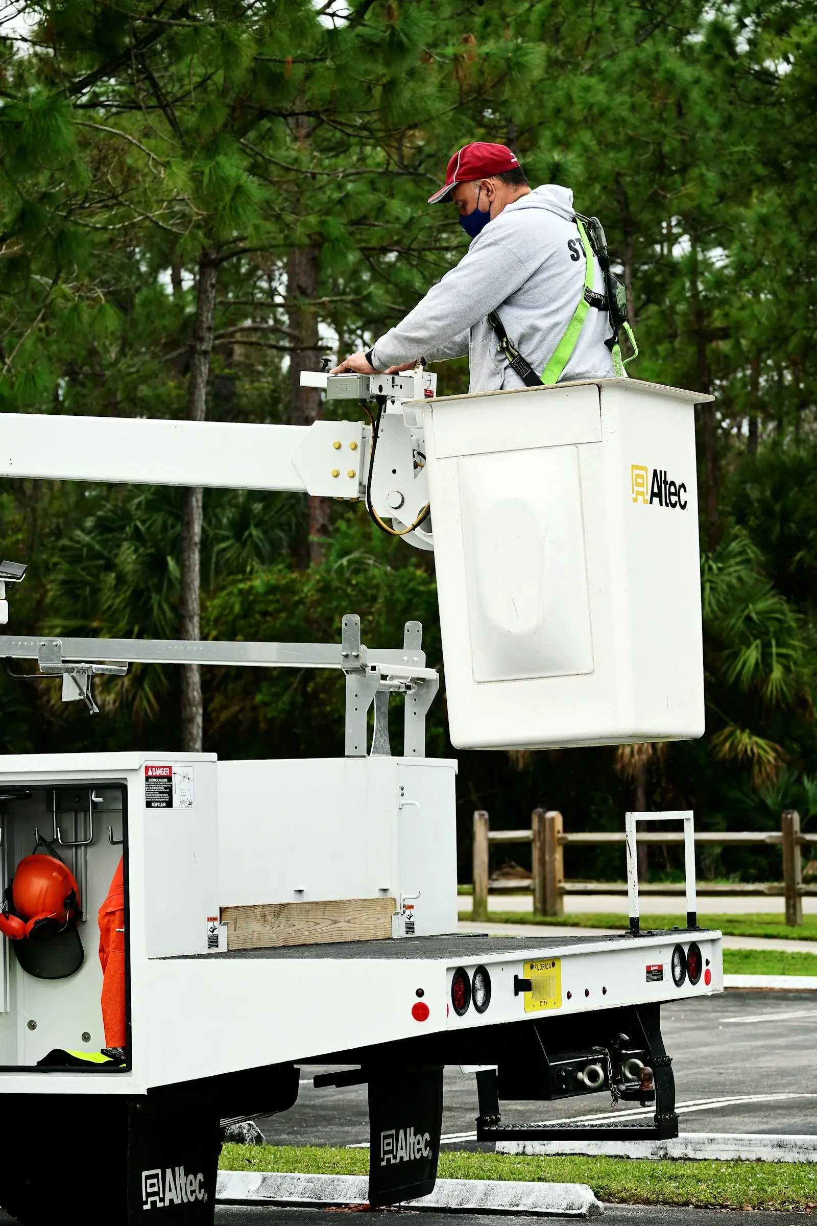 Bucket truck staged for professional tree service and overhead access